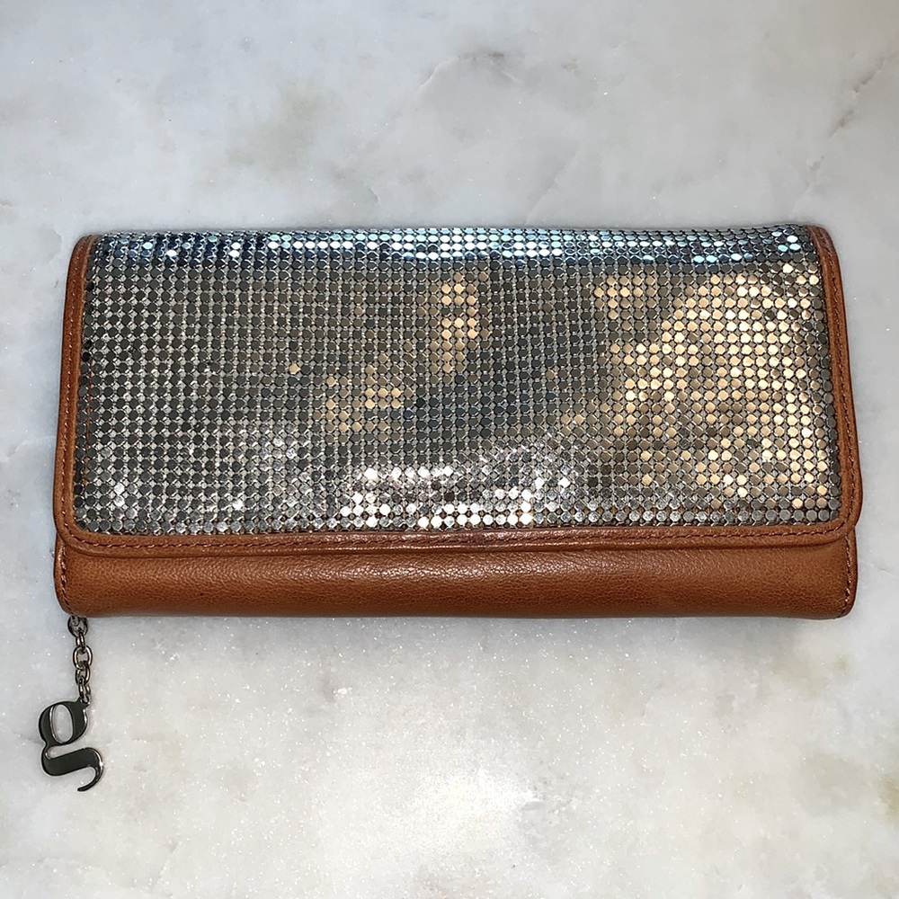 Leather clutch with silver mesh front.  Zipper compartments.